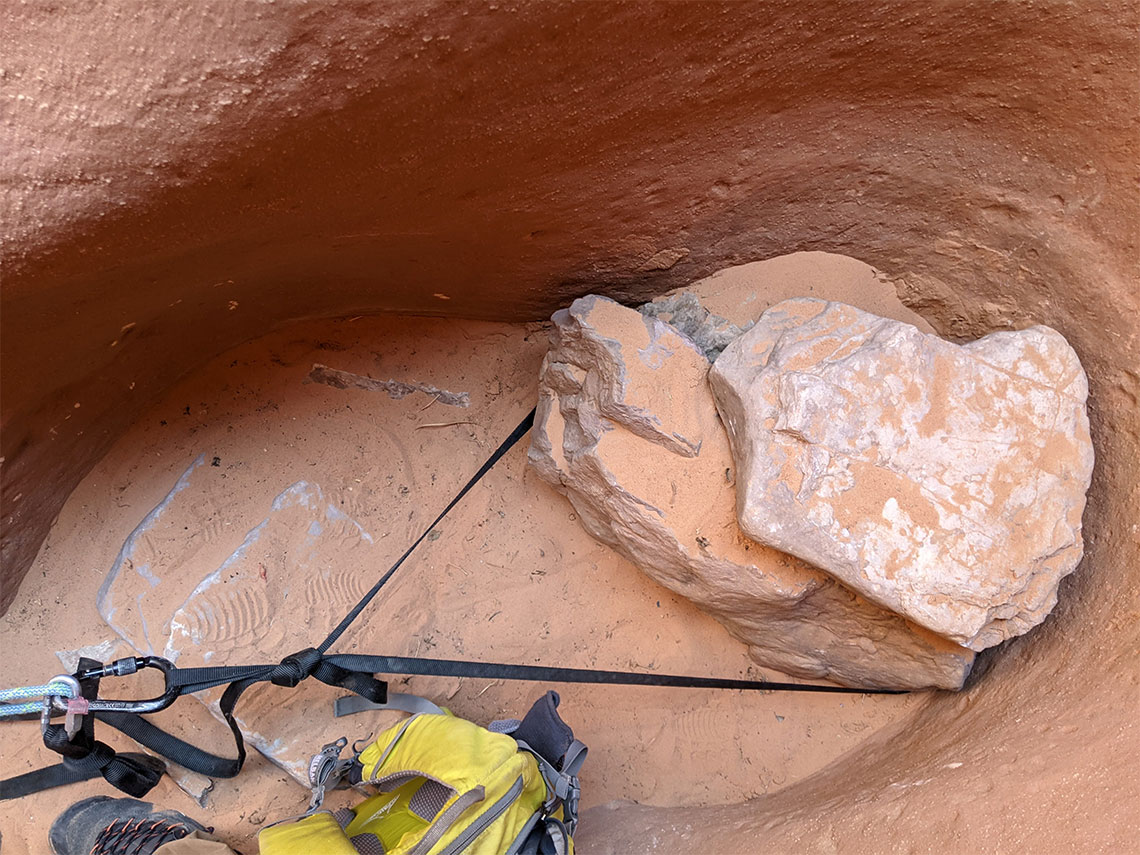 A couple of large stones provide a solid anchor for the last rappel in Leprechaun Canyon