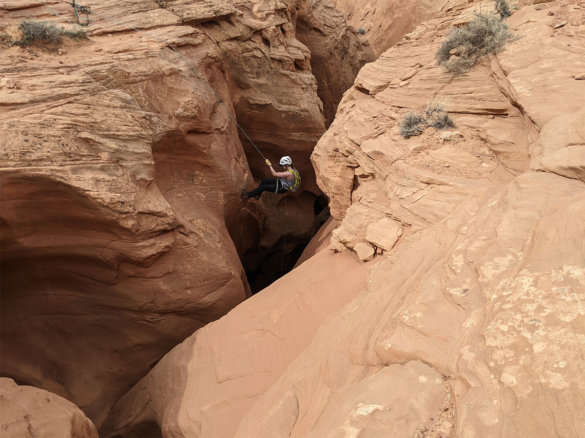 Disappearing into the slot of Leprechaun Canyon on the second rappel